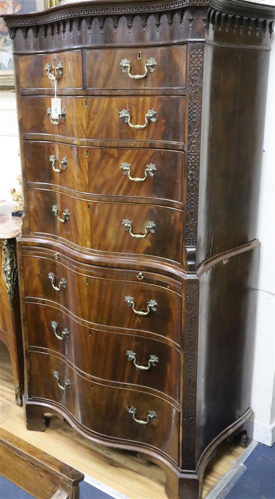 A 1920s Chippendale revival serpentine mahogany chest on chest W.90cm